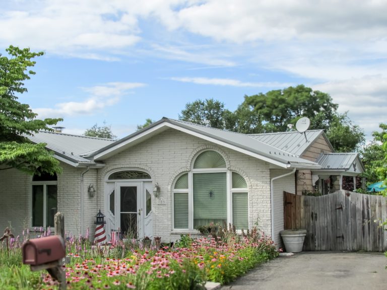 House with metal roof (D-rib) installed by Midstate Roofing LLC